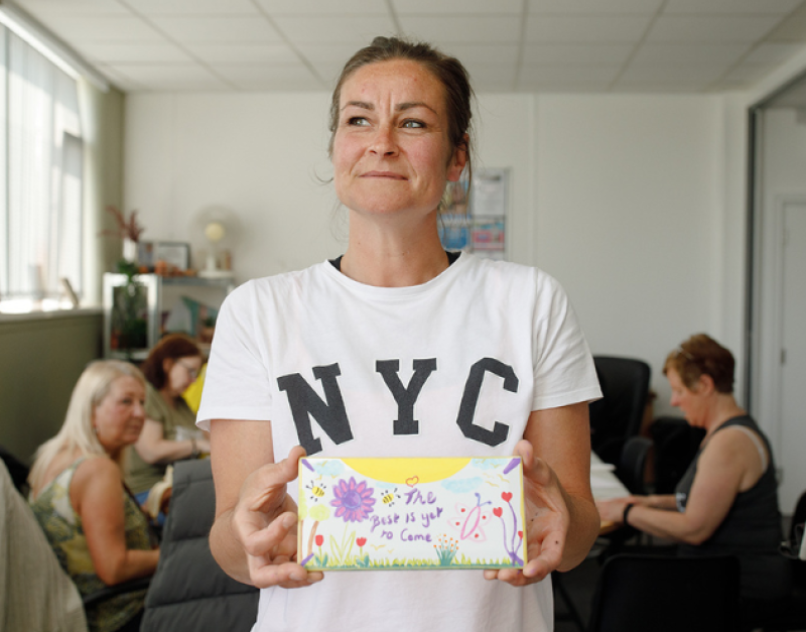 Smiling young woman smiling during a one-to-one session, representing support for young people at CDAS.