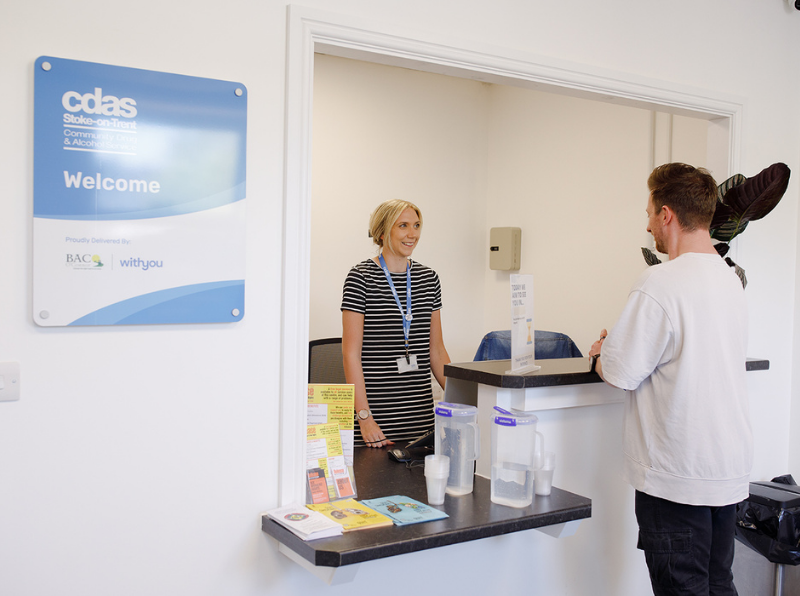 Staff member welcoming a visitor at CDAS Whittle Court reception