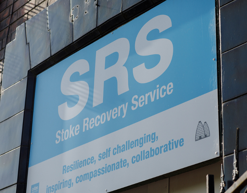 Exterior sign for Stoke Recovery Service (SRS), part of CDAS, showing the words 'Resilience, self challenging, inspiring, compassionate, collaborative'