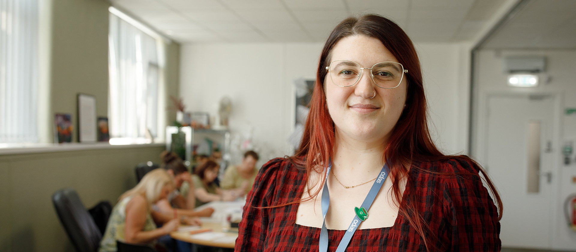 Jessica Wilson, Recovery Worker at CDAS, pictured with a blurred background of a creative group support session