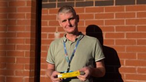 Staff member Steve holding naloxone